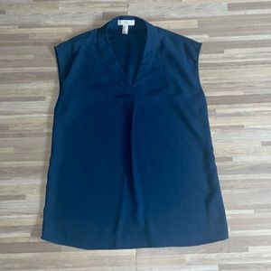 Halston high end woman wear. Teal sleeveless v neck